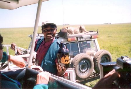 Serengeti, Tanzania (and YES that's a real cheetah behind him)